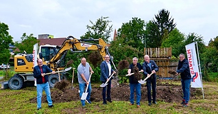 Symbolischer Spatenstich für ein zukunftsweisendes Bauprojekt.
