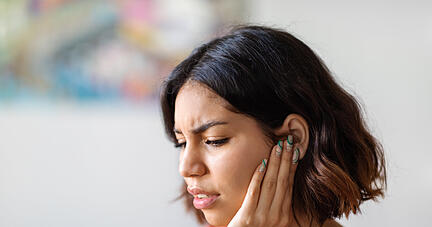 Ears Pain. Sick Young Arab Woman Suffering From Earache At Home, Upset Middle Eastern Female Having Otitis Illness And Healthcare Problems, Millennial Lady Frowning While Rubbing Sore Auricle