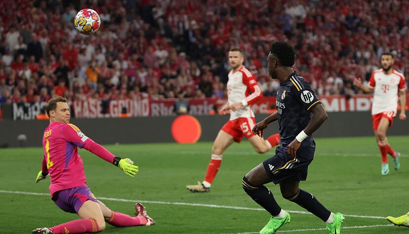 Anfang April kommt es in der Champions League zum n&auml;chsten Duell von Manuel Neuer (l) mit Real Madrids St&uuml;rmerstar Vin&iacute;cius J&uacute;nior. (Archivbild)