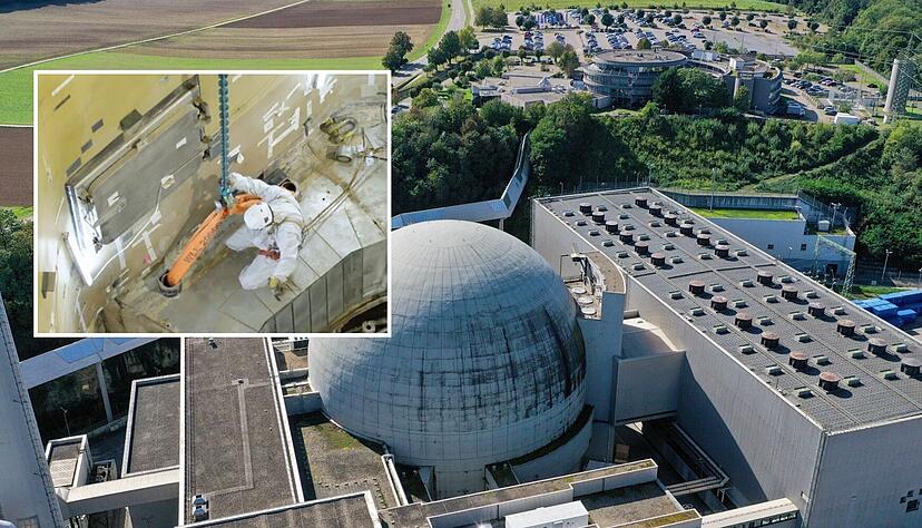 Im 2011 abgeschalteten Block I des GKN in Neckarwestheim (großes Foto) sind die Rückbauarbeiten schon weit fortgeschritten. Ein Mitarbeiter bereitet ein zwölf Tonnen schweres Betonsegment aus dem Ringträger, in dem der Reaktorbehälter verankert war, für den Abtransport per Kran vor (kleines Foto). Im 2011 abgeschalteten Block I des GKN in Neckarwestheim (großes Foto) sind die Rückbauarbeiten schon weit fortgeschritten. Ein Mitarbeiter bereitet ein zwölf Tonnen schweres Betonsegment aus dem Ringträger, in dem der Reaktorbehälter verankert war, für den Abtransport per Kran vor (kleines Foto).