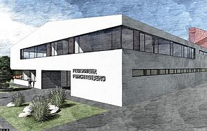 Der Blick von der Abzweigung an der L1045: Im Obergeschoss sind Schulungsr&auml;ume geplant, hinter der schmalen Fensterreihe im Erdgeschoss die Umkleidekabinen.