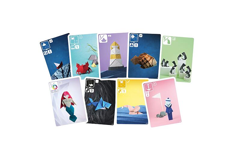 Schöne Origami-Motive mit Booten, Meerjungfrauen oder Muscheln schmücken die Karten des Spiels «Sea Salt & Paper». Schöne Origami-Motive mit Booten, Meerjungfrauen oder Muscheln schmücken die Karten des Spiels «Sea Salt & Paper».