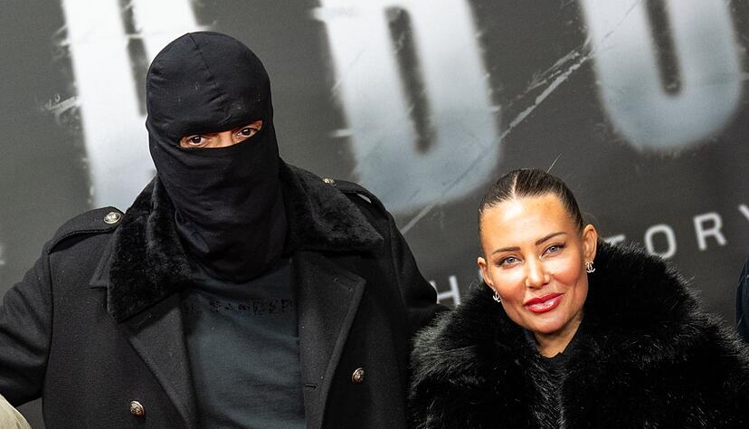 Haftbefehl (bürgerlich Aykut Anhan und hier verhüllt) besucht mit seiner Frau Nina Anhan eine Kinoaufführung der Dokumentation «Babo - Die Haftbefehl-Story» in Berlin. (Archivbild) Haftbefehl (bürgerlich Aykut Anhan und hier verhüllt) besucht mit seiner Frau Nina Anhan eine Kinoaufführung der Dokumentation «Babo - Die Haftbefehl-Story» in Berlin. (Archivbild)