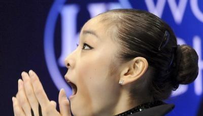 Die Südkoreanerin Yu-Na Kim freut sich über die Bewertung. Die Südkoreanerin Yu-Na Kim freut sich über die Bewertung.