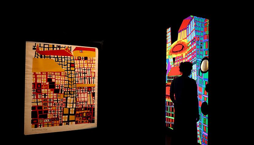 Hundertwasser ist bekannt f&uuml;r bunte Farben wie im Linolschnitt "Drei hohe H&auml;user".