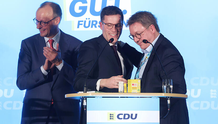 Wahlkampf der CDU in Bad Rappenau (von links): Bundeskanzler Friedrich Merz, Spitzenkandidat Manuel Hagel und Landtagskandidat Michael Preusch.