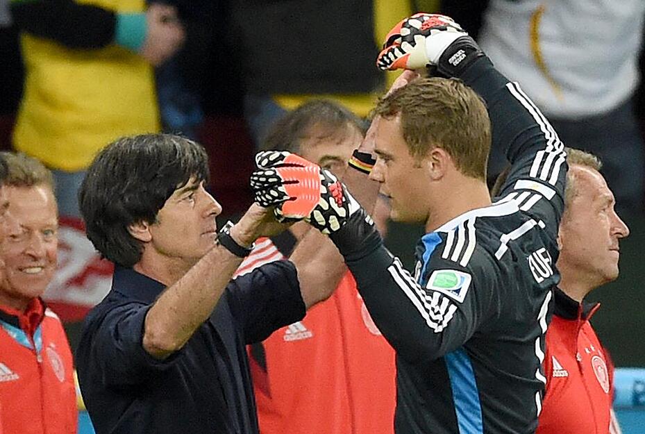 Germany's head coach Joachim Loew (L) celebrates with goalkeeper Manuel Neuer after the FIFA&nbsp;World Cup 2014 round of 16 soccer match between Germany and Algeria at the Estadio Beira-Rio in Porto Alegre, Brazil, 30 June 2014. Photo:&nbsp;Marcus Brandt/dpa (RESTRICTIONS APPLY: Editorial Use Only, not used in association with any commercial entity - Images must not be used in any form of alert service or push service of any kind including via mobile alert services, downloads to mobile devices or MMS messaging - Images must appear as still images and must not emulate match action video footage - No alteration is made to, and no text or image is superimposed over, any published image which: (a) intentionally obscures or removes a sponsor identification image; or (b) adds or overlays the commercial identification of any third party which is not officially associated with the FIFA World Cup) EDITORIAL USE ONLY +++(c) dpa - Bildfunk+++