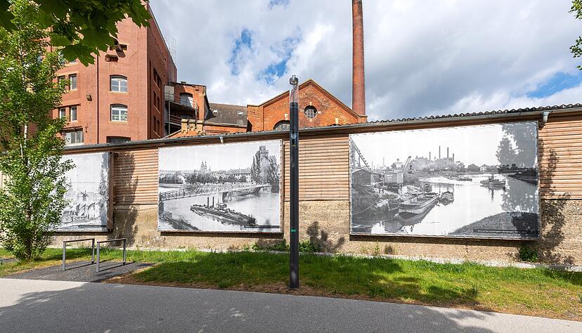 Transparente mit historischen Fotos aus dem Stadtarchiv lassen am Werk von Otto Rettenmaier und an der Alten Reederei die &minus; einstmals &minus; große Rolle der Neckarschifffahrt erahnen.
Fotos: Mario Berger