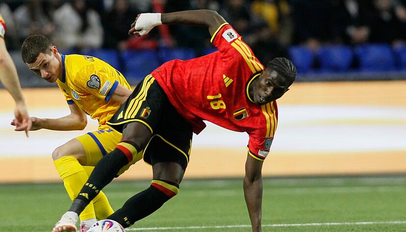 Die Belgier um Amadou Onana (r.) kamen in Kasachstan ins Stolpern. Die Belgier um Amadou Onana (r.) kamen in Kasachstan ins Stolpern.