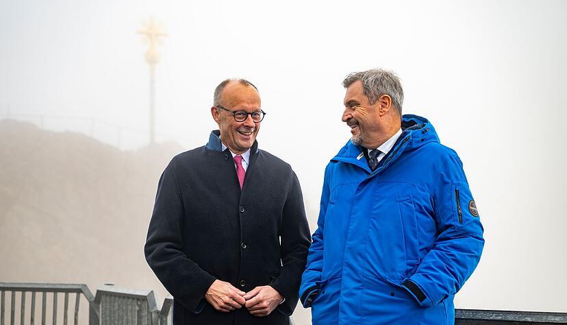 In den Wolken: Merz und Söder auf der Zugspitze. In den Wolken: Merz und Söder auf der Zugspitze.