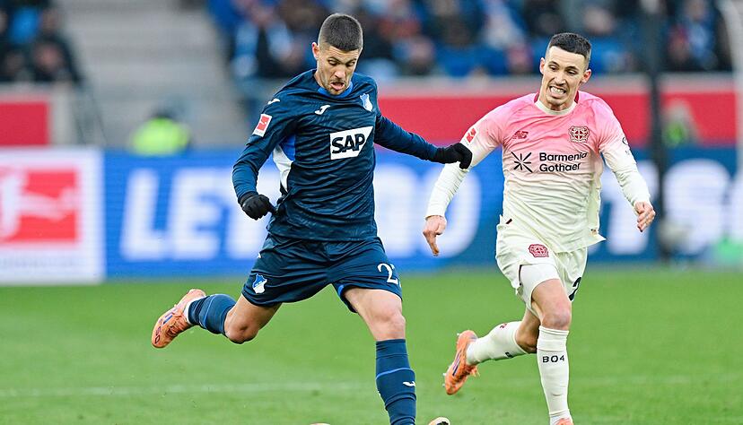 Bayer und Grimaldo (r.) rennen gegen Hoffenheim und Kramaric viel hinterher. Bayer und Grimaldo (r.) rennen gegen Hoffenheim und Kramaric viel hinterher.