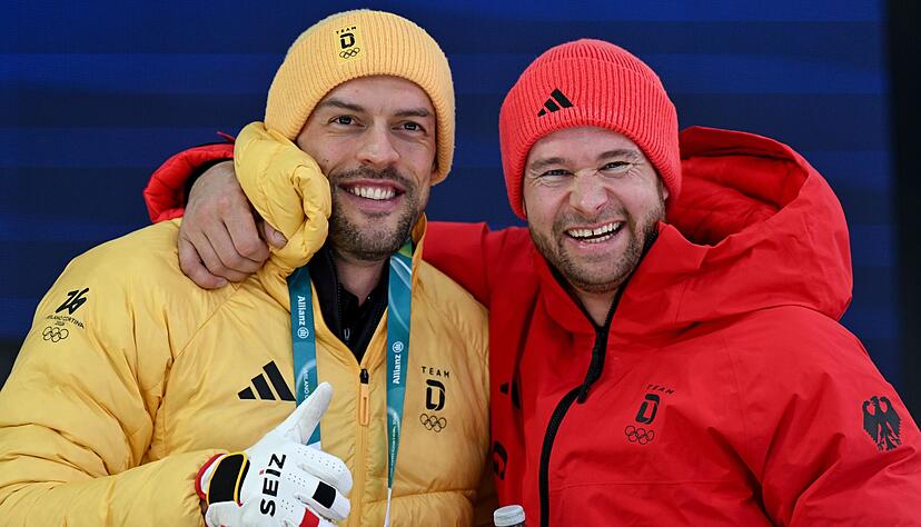 F&uuml;hren zur Halbzeit des Zweier-Wettbewerbs: Pilot Johannes Lochner (rechts) und sein Anschieber Georg Fleischhauer.