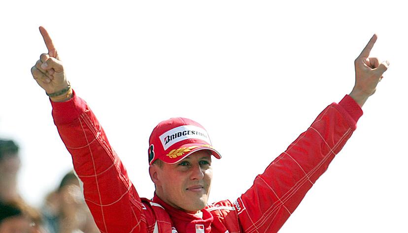 Formel-1-Legende Michael Schumacher, damals Scuderia Ferrari, feiert seinen Sieg beim Großen Preis von Italien in Monza im Jahr 2006. Formel-1-Legende Michael Schumacher, damals Scuderia Ferrari, feiert seinen Sieg beim Großen Preis von Italien in Monza im Jahr 2006.
