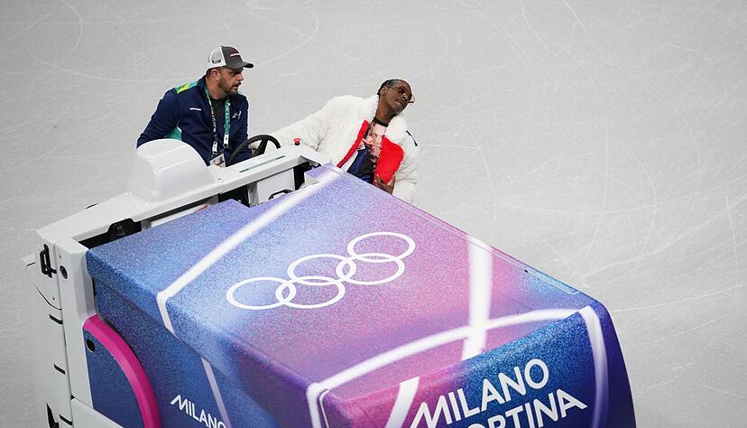 Snoop Dogg (r) ist für den US-Sender NBC bei den Winterspielen. Snoop Dogg (r) ist für den US-Sender NBC bei den Winterspielen.