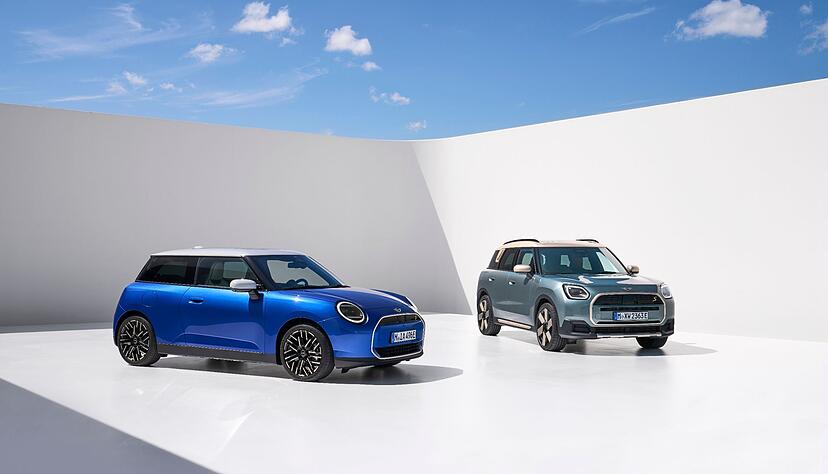 Mini oder Maxi? Ganz so klein wie ihr Firmenname suggeriert, sind der Mini Cooper (links) und der Mini Countryman längst nicht mehr - der knuffige Look ist geblieben.