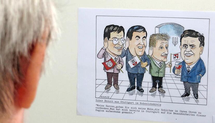 Schlitzohrig sind sie, die Hohenloher. Das hat nicht nur Erwin Teufel bei seinem Besuch im Jahr 1991 erfahren. Heinz Knaus hat die Szene karikiert.Foto: Peter Hohl Schlitzohrig sind sie, die Hohenloher. Das hat nicht nur Erwin Teufel bei seinem Besuch im Jahr 1991 erfahren. Heinz Knaus hat die Szene karikiert.Foto: Peter Hohl